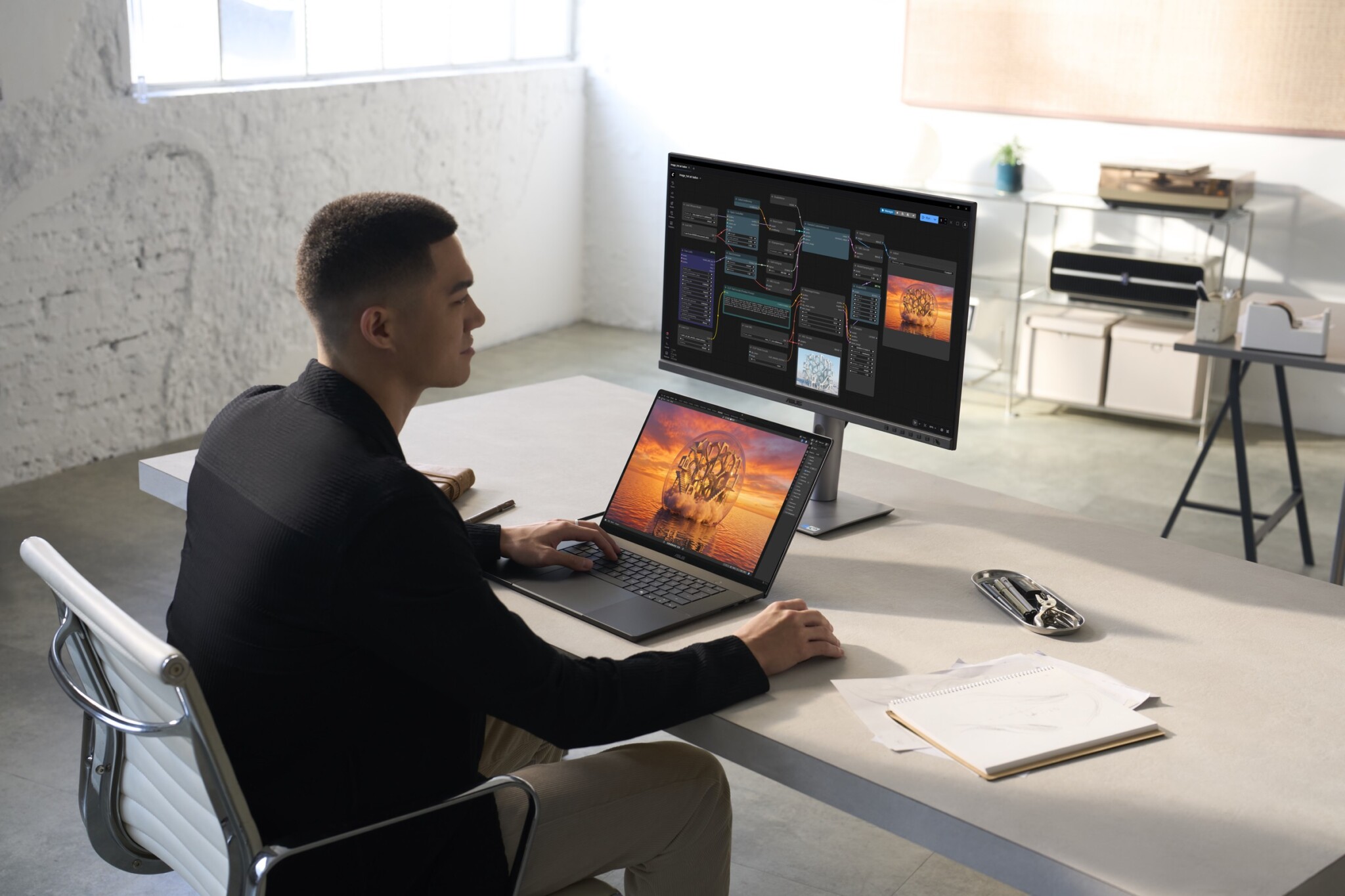 The ProArt P16 set up at a desk with an external monitor.