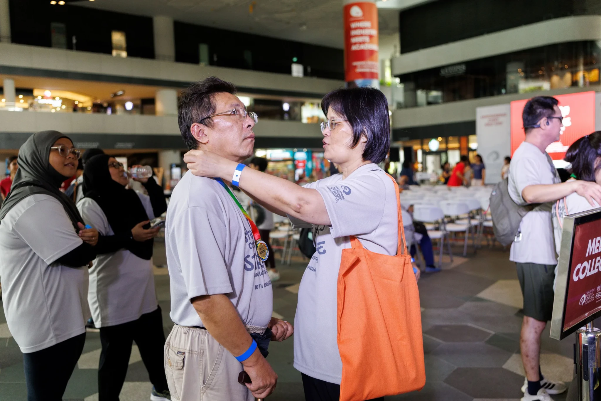 A participant receives a medal at last year's Stepping Out for Stroke