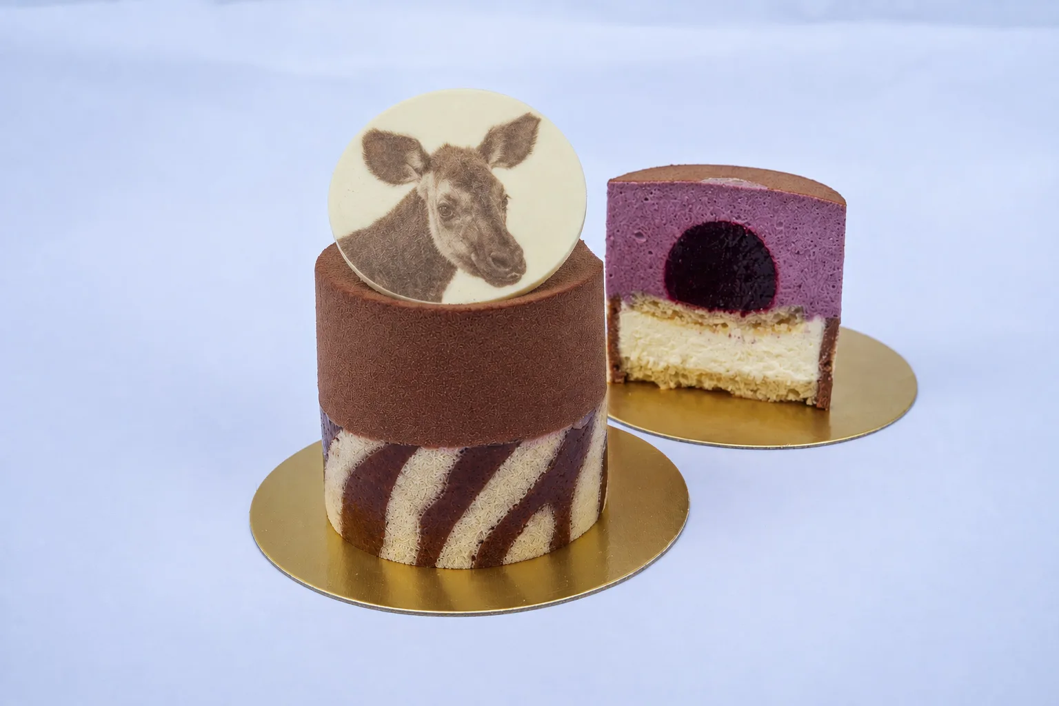 Okapi-inspired cakes with striped patterns and okapi artwork